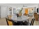 Cozy dining area with stylish table and chairs, open to the living space and balcony at 16308 Gulf Blvd # 303, Redington Beach, FL 33708