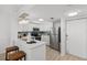 Modern kitchen featuring white cabinets, stainless steel appliances, and breakfast bar at 16308 Gulf Blvd # 303, Redington Beach, FL 33708