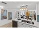 Bright, open kitchen flows into the living space with modern appliances and decor at 16308 Gulf Blvd # 303, Redington Beach, FL 33708