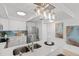 Bright kitchen featuring white cabinets, stainless steel appliances, and modern lighting at 16308 Gulf Blvd # 303, Redington Beach, FL 33708