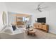 Cozy living room with modern decor, balcony access, comfortable seating, and a lovely interior design at 16308 Gulf Blvd # 303, Redington Beach, FL 33708