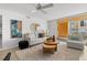Bright living room with cozy seating, stylish decor, and balcony access with building views at 16308 Gulf Blvd # 303, Redington Beach, FL 33708