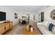Open-concept living room features sleek furniture, stylish decor, and seamless flow to the kitchen at 16308 Gulf Blvd # 303, Redington Beach, FL 33708