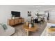 Relaxing living room with modern furnishings, entertainment center, and adjacent eat-in kitchen at 16308 Gulf Blvd # 303, Redington Beach, FL 33708