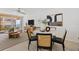 Bright living room features modern decor, dining area, balcony access with beautiful water views at 16308 Gulf Blvd # 303, Redington Beach, FL 33708