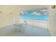 Outdoor patio area featuring table and chairs with ocean view at 16308 Gulf Blvd # 303, Redington Beach, FL 33708