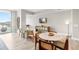 Bright living room featuring contemporary furniture, a mounted TV, and sliding glass doors to a balcony with water views at 5120 Marina Way # 112, Tampa, FL 33611