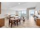 Spacious living room featuring modern furniture, light wood floors, and access to a balcony with a water view at 5120 Marina Way # 112, Tampa, FL 33611