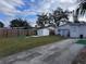 Backyard with storage shed and paved area at 813 89Th N Ave, St Petersburg, FL 33702