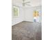 Bedroom with carpet flooring and access to patio at 813 89Th N Ave, St Petersburg, FL 33702