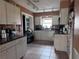 Kitchen with light wood cabinets and dark countertops at 813 89Th N Ave, St Petersburg, FL 33702