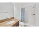 Well-lit bathroom with shower/tub combo and granite countertop at 11926 Cinnamon Fern Dr, Riverview, FL 33579