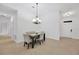 Bright dining room with a chandelier and seating for four at 11926 Cinnamon Fern Dr, Riverview, FL 33579