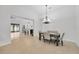 Open dining room with a chandelier and kitchen view at 11926 Cinnamon Fern Dr, Riverview, FL 33579