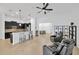 Modern kitchen with dark cabinetry and breakfast bar at 11926 Cinnamon Fern Dr, Riverview, FL 33579
