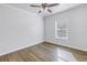 Bedroom featuring wood floors, a ceiling fan, and bright window at 1521 Preston S St, St Petersburg, FL 33712