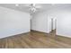 A spacious bedroom features wood look flooring and an ensuite bathroom at 1521 Preston S St, St Petersburg, FL 33712
