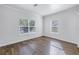 Cozy bedroom featuring two bright windows and wood flooring at 1521 Preston S St, St Petersburg, FL 33712