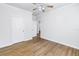A light-filled bedroom featuring a ceiling fan and attractive wood-look floors at 1521 Preston S St, St Petersburg, FL 33712