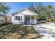 Charming home with a well-manicured lawn and a freshly paved driveway at 1521 Preston S St, St Petersburg, FL 33712