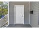 Charming front entry featuring a gray exterior, white trim, and black mailbox at 1521 Preston S St, St Petersburg, FL 33712