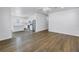 Open-concept living space flowing to the kitchen with stainless appliances and bright lighting at 1521 Preston S St, St Petersburg, FL 33712