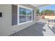 Front porch featuring gray siding and wood-look flooring at 1521 Preston S St, St Petersburg, FL 33712