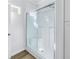 Modern shower featuring glass doors and white finishings at 1521 Preston S St, St Petersburg, FL 33712