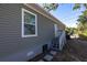 The side exterior of the house with windows at 1521 Preston S St, St Petersburg, FL 33712