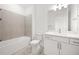 Bright bathroom with a shower-tub combo and modern vanity featuring drawers and cabinet space at 17203 Luminous Ave, Venice, FL 34293