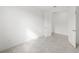 Neutral bedroom with tile flooring featuring doors leading to closet and entry way at 17203 Luminous Ave, Venice, FL 34293