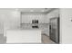 Modern kitchen with stainless steel appliances, white cabinetry, and granite counter tops at 17203 Luminous Ave, Venice, FL 34293