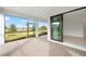 Screened-in patio with brick flooring, a view of the backyard, and sliding glass doors at 17203 Luminous Ave, Venice, FL 34293