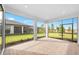 Screened-in patio area with brick flooring and an open view of the backyard at 17203 Luminous Ave, Venice, FL 34293