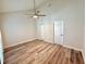 Bright bedroom with wood-look floors and ceiling fan at 320 Island Way # 303, Clearwater Beach, FL 33767