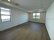 Spacious bedroom with hardwood floors and large windows at 5633 Clearwater Ct, Lakewood Ranch, FL 34211