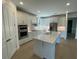 Modern kitchen featuring a large island and stainless steel appliances at 5633 Clearwater Ct, Lakewood Ranch, FL 34211