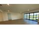 Living area with hardwood floors and sliding glass doors leading to patio at 5633 Clearwater Ct, Lakewood Ranch, FL 34211
