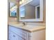 Bathroom with single vanity and large mirror at 6060 Shore S Blvd # 601, Gulfport, FL 33707