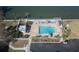 Community pool with lounge chairs and waterfront view at 6060 Shore S Blvd # 601, Gulfport, FL 33707