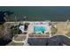 Community pool with lounge chairs and waterfront views at 6060 Shore S Blvd # 601, Gulfport, FL 33707