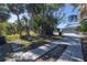 Tranquil backyard featuring mature trees, grass and a concrete patio at 719 19Th S St, St Petersburg, FL 33712