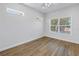 Bedroom with natural light and wood-look vinyl flooring at 719 19Th S St, St Petersburg, FL 33712