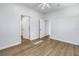 This bedroom features wood-look vinyl flooring and multiple doorways at 719 19Th S St, St Petersburg, FL 33712