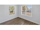 A light and airy bedroom with beautiful wood-look flooring and bright natural light at 719 19Th S St, St Petersburg, FL 33712