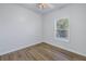 Well-lit bedroom features wood-look flooring and natural light from a window at 719 19Th S St, St Petersburg, FL 33712