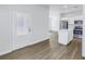 View from entryway towards kitchen showing the open concept design and cohesive flooring throughout at 719 19Th S St, St Petersburg, FL 33712