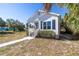 Exterior view of home, featuring a cozy porch and a well-kept lawn at 719 19Th S St, St Petersburg, FL 33712