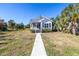 Inviting home showcasing a well-maintained lawn and attractive curb appeal at 719 19Th S St, St Petersburg, FL 33712