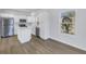 Well-lit kitchen featuring white cabinetry, stainless steel appliances, and a functional center island with quartz countertop at 719 19Th S St, St Petersburg, FL 33712